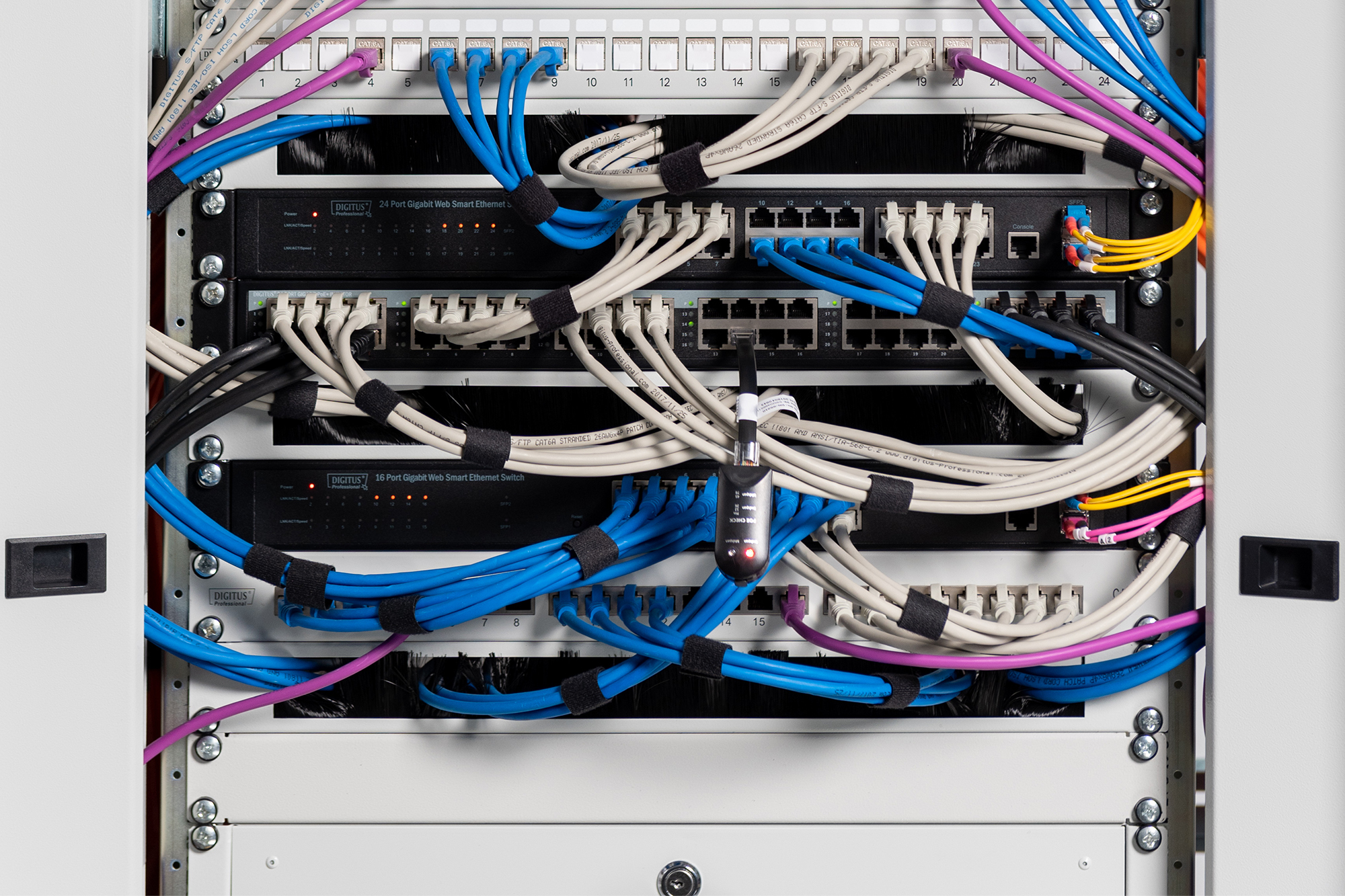 server rack, network switch, ethernet cables, patch panel, rack mounting