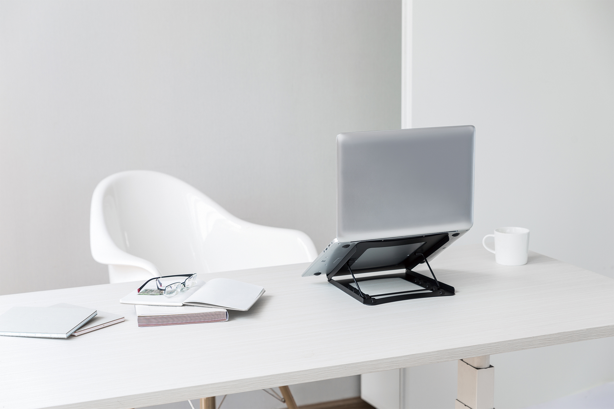 Laptop stand, Laptop, Desk, White chair, Workspace